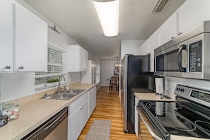 The Kitchen has updated stainless steel appliances, & all the items from home. 