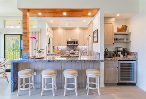 The remodeled chef`s kitchen sits adjacent to the dining area