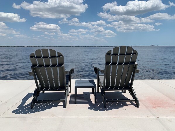 Patio at water's edge for relaxing, fishing, and watching dolphins play.