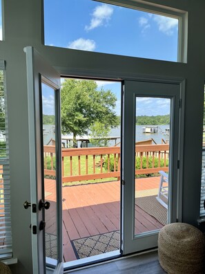 French doors that open to the front porch with views of the water