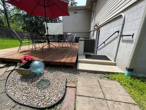 Private deck and entry into the ground floor apartment. handicap access W/garage