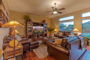 Cozy family room offers a comfortable gathering area for watching TV or admiring the view.