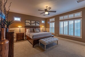Primary suite features a king bed, en  suite bath, TV, walk in closet and stellar views.