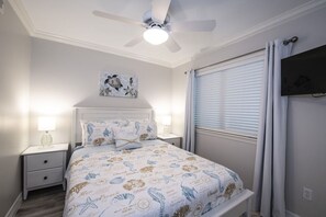 Secondary bedroom with a new queen bed for your rest and relaxation.