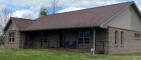 Front of home with large yard!  Plenty of outdoor space for the family to play. 