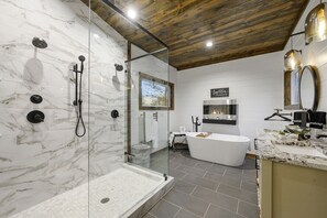 This fireplace in the bathroom sets a cozy scene