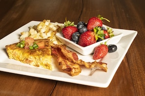 Casserole made with fresh farm eggs, bacon, hash browns, & fresh picked berries.