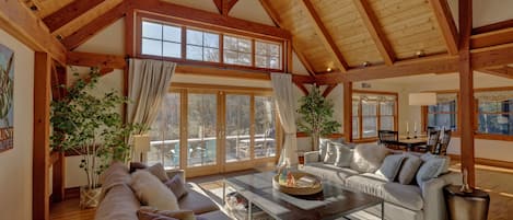 Living room with cathedral ceiling and view of Mt. Sunapee.