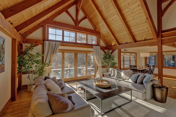 Living room with cathedral ceiling and view of Mt. Sunapee.