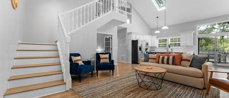 Lots of seating and natural light throughout the home thanks to skylights and big windows leading out onto the back deck