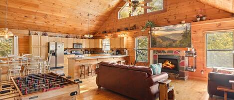 Grand, spacious living room flooded with natural light.