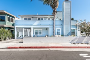 Street view of the property. This home includes 1-2 reserved parking spaces in the carport (small to mid-size vehicles recommended).