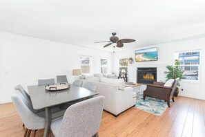 The main living area - located on the ground floor - is bright and cheery, perfect for unwinding after a day at the beach.
                