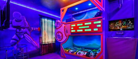 Kids will love the upstairs Star Wars themed bedroom with cool lights and bunk beds!