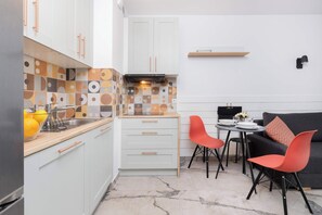 Fully equipped kitchenette with dining area.