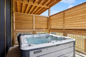 Relax in the hot tub after a day of hiking in the national park | Eaglebend Cabin by Great Smoky Mountains Cabin Rentals | Sevierville, TN