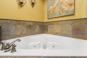 Bathroom 1, bedroom 1 en-suite with jetted tub, and stand up shower