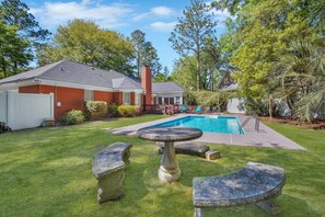 Outdoor seating in our big yard around the pool!