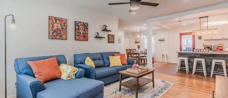 Spacious open concept living area with Spanish theme.