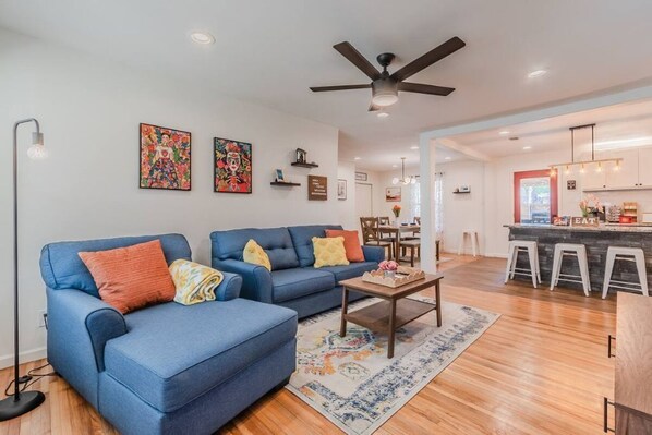 Spacious open concept living area with Spanish theme.