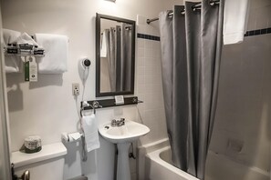 Bathroom with shower and tub. Basic toiletries and towels are provided