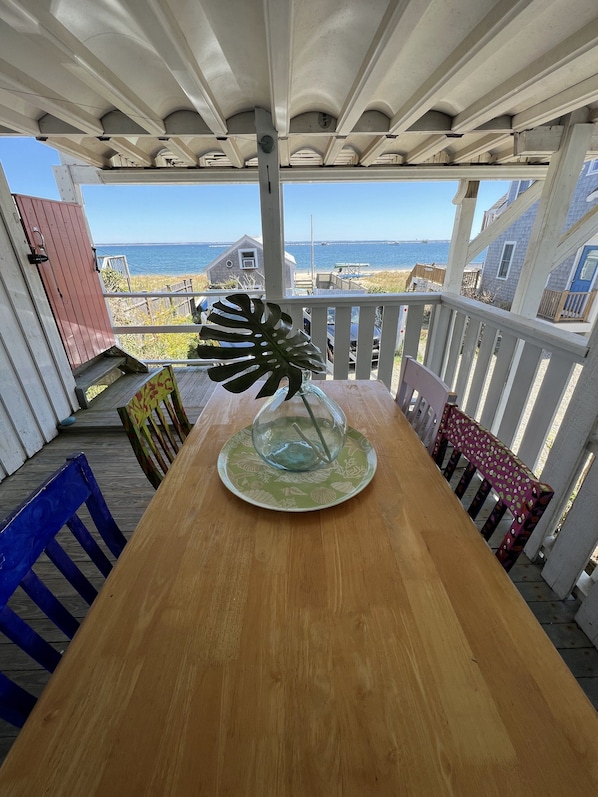 Covered porch with direct water views.