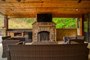 Relax outdoors with wood burning fireplace and outdoor T.V. 