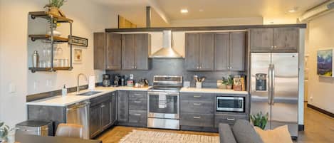 Fully stocked kitchen with top of the line appliances.