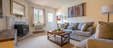 Living Room with Queen Sleeper Sofa, Fireplace, and 55" Smart TV