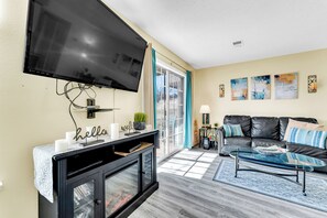 Living Room TV and electric fireplace. Couch pulls out to futon