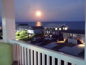Full moon rising over the water 