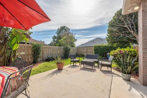 A private fenced backyard is at the house. Enjoy the sun outside!