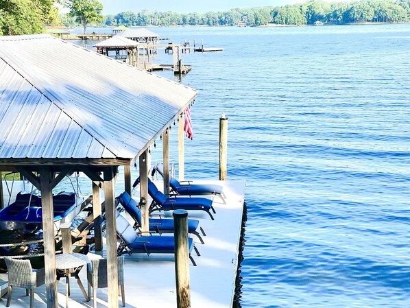 Oversized private dock and resort-style lounge chairs