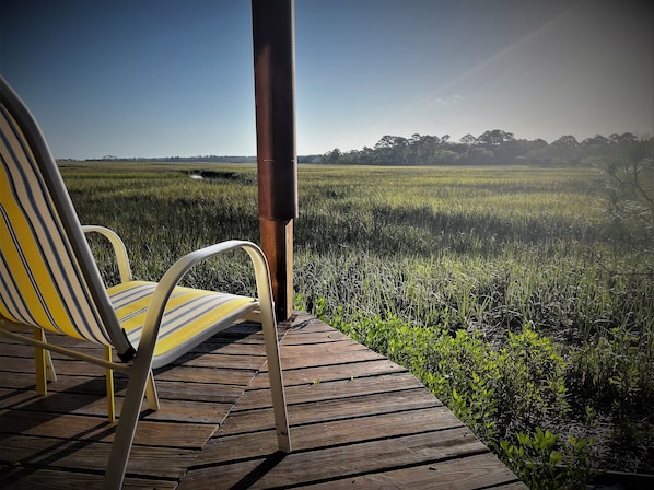 Lower Deck.  Sits just feet from the marsh. Perfect spot for morning coffee.
