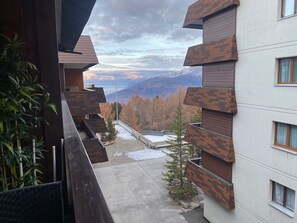 Sky, Cloud, Mountain, Building, Property, Car, Vehicle, Plant, Wheel, Architecture