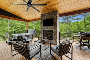 Relax and unwind on the spacious deck, complete with a seasonal gas fireplace (October 1 - March 31), TV, grill and cozy outdoor furniture—perfect for any time of year.