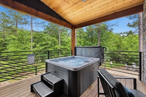 Our large deck allows for relaxing, grilling, tv watching and hot tub soaking! The best part are the views.