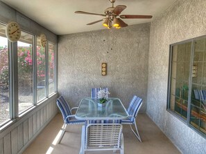Covered indoor/outdoor patio with seating for 6