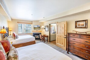 The large guest suite has a private work desk, a gas fireplace, and lots of storage