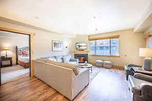The main living room is open, bright and spacious with plenty of comfortable seating