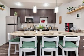 This kitchen packs lots of functionality and the ability to entertain friends within a small space. :)