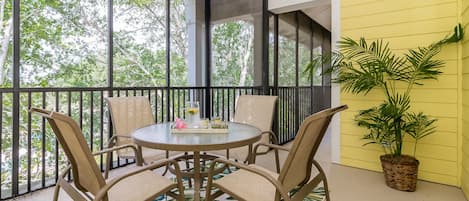 Screened HUGE balcony outside of bedroom 3 with outdoor seating