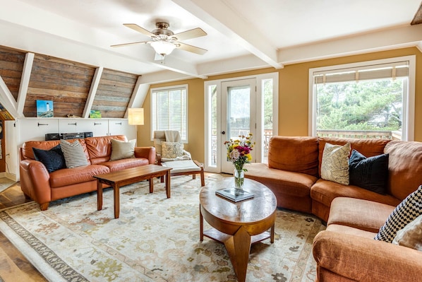 Spacious second floor living room with plenty of seating.