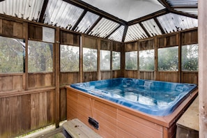 Enjoy the covered hot tub on stormy days!