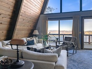 From the foyer. Facing the double story windows with views of the lake.