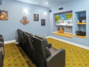 Head on over to the Theater Room where you can relax in these fantastic theater-style chairs and watch your favorite movie on the Oversized Flat Screen TV.