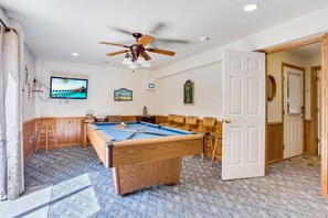 Have some fun in the Game Room with a Pool Table and Flat Screen TV!