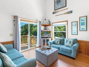 Relax in the Top-Level Living Area with lots of natural sunlight.