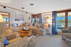 Relax in the beautiful Living Area with high ceilings and welcoming decor.