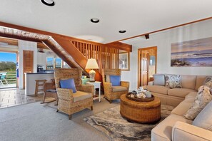 Relax in the beautiful Living Area with high ceilings and welcoming decor.